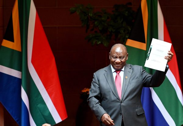 President Cyril Ramaphosa signs into law the National Health Insurance Bill at the Union Buildings in Pretoria, South Africa on Wednesday, May. 15, 2024.  Photographer: Leon Sadiki/Bloomberg